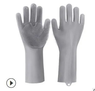 A pair of blue silicone cleaning gloves with a textured sponge-like surface for scrubbing.
