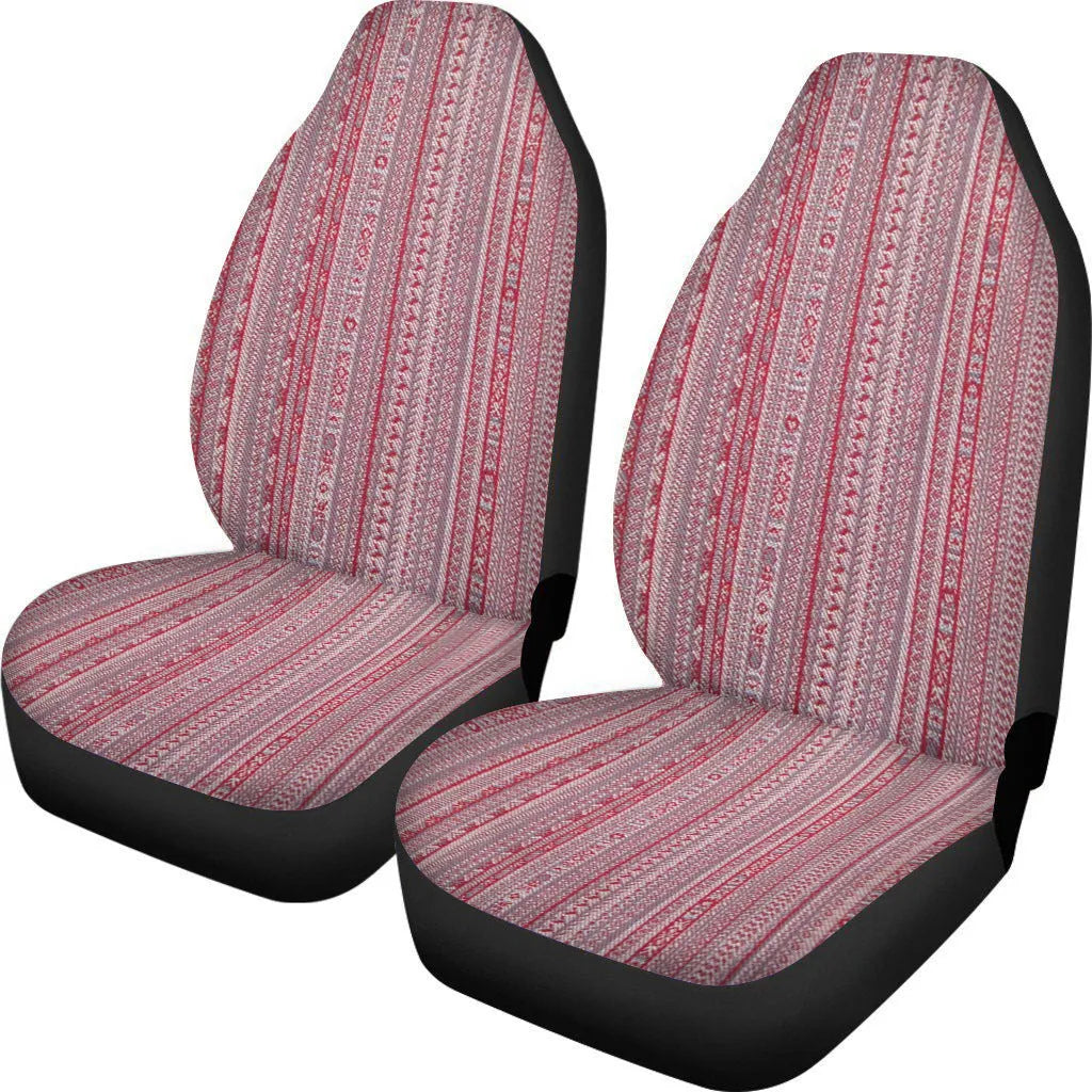 Pair of universal car seat covers in a cow spot leopard print retro pattern on a car front seat.