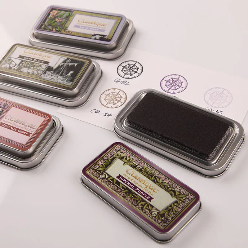 Rectangular oily ink pad for rubber stamps in Cocoa Brown, Fog Blue, Gray Pink, Green, or Leaf Green, measuring 0.3x5.7x1.7cm.