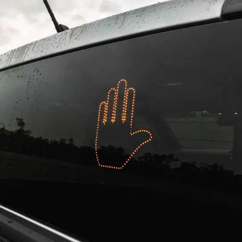 Black plastic LED gesture car light with remote control showing three-finger gesture