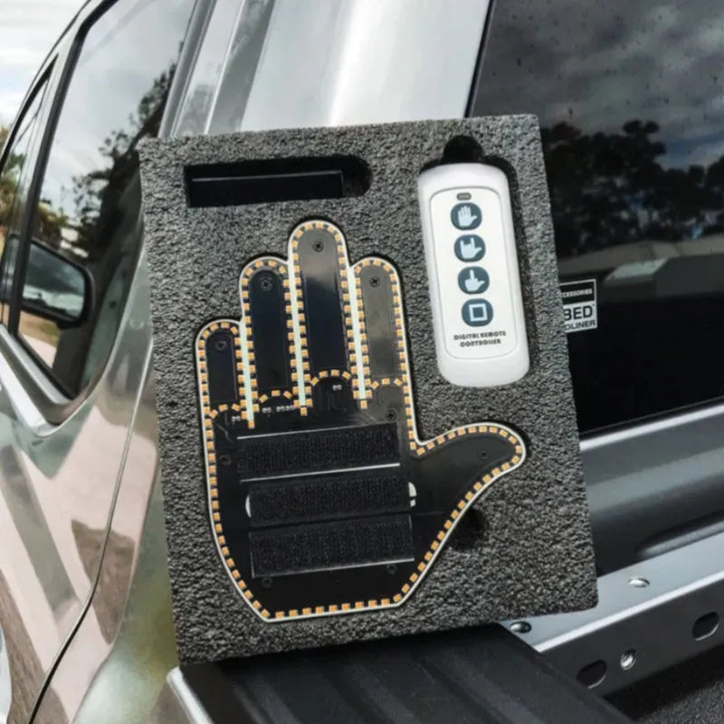 Black plastic LED gesture car light with remote control showing three-finger gesture