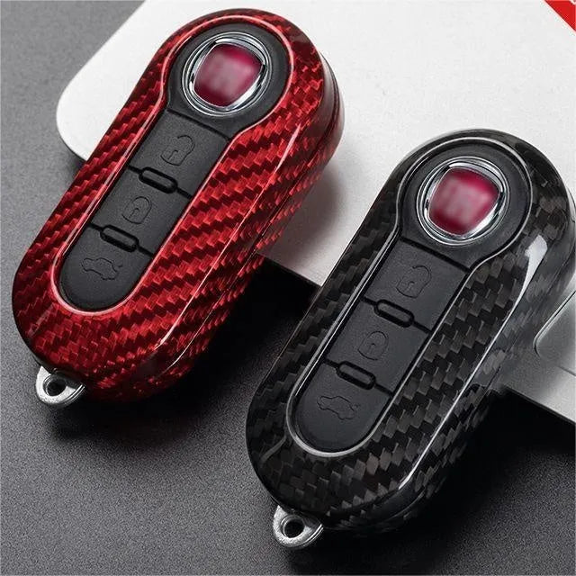 Carbon fibre vehicle key shell replacement cover showing precise button cutouts and textured surface