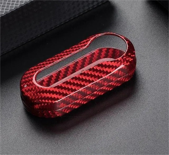 Carbon fibre vehicle key shell replacement cover showing precise button cutouts and textured surface