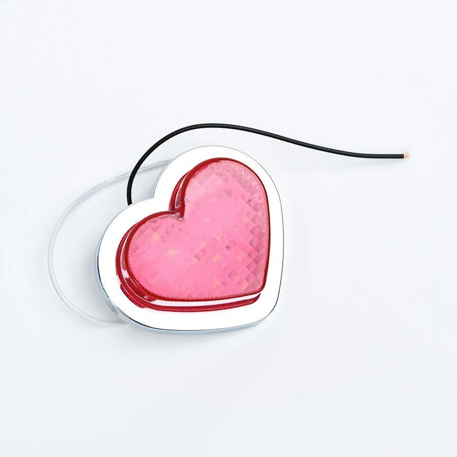 Heart-shaped LED vehicle sidelight in red colour showing Japanese-style design