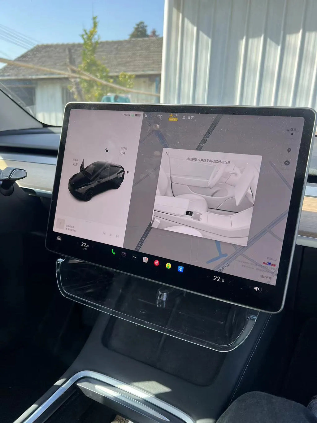 Black ABS storage box for Tesla Model 3 and Y, positioned under the centre touchscreen.