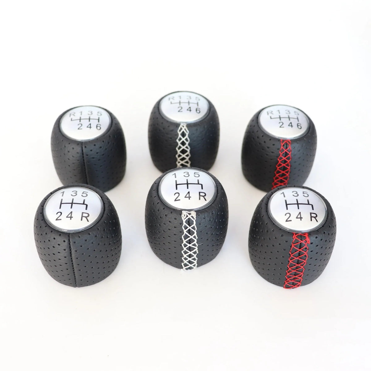 Sewn wrapped perforated leather gear lever handball for Alpha car in black, red, and white line options.