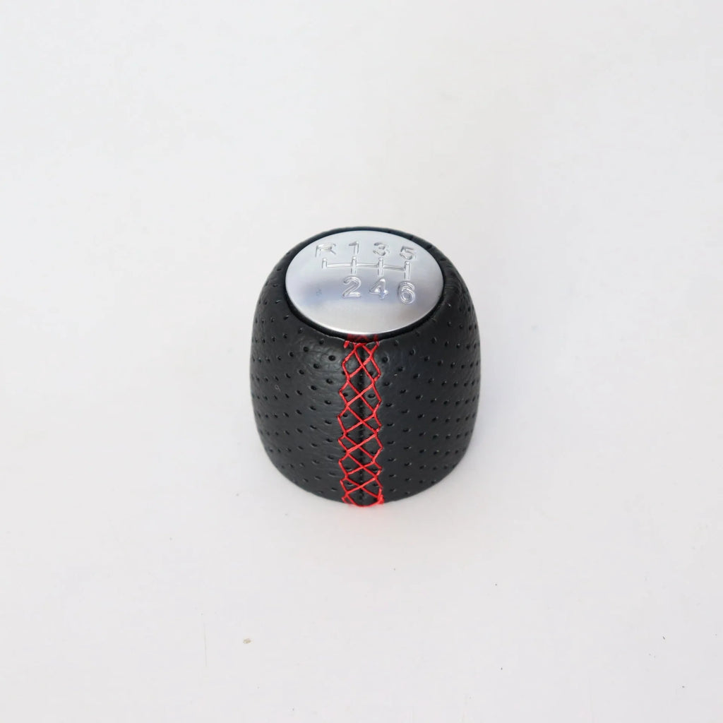 Sewn wrapped perforated leather gear lever handball for Alpha car in black, red, and white line options.