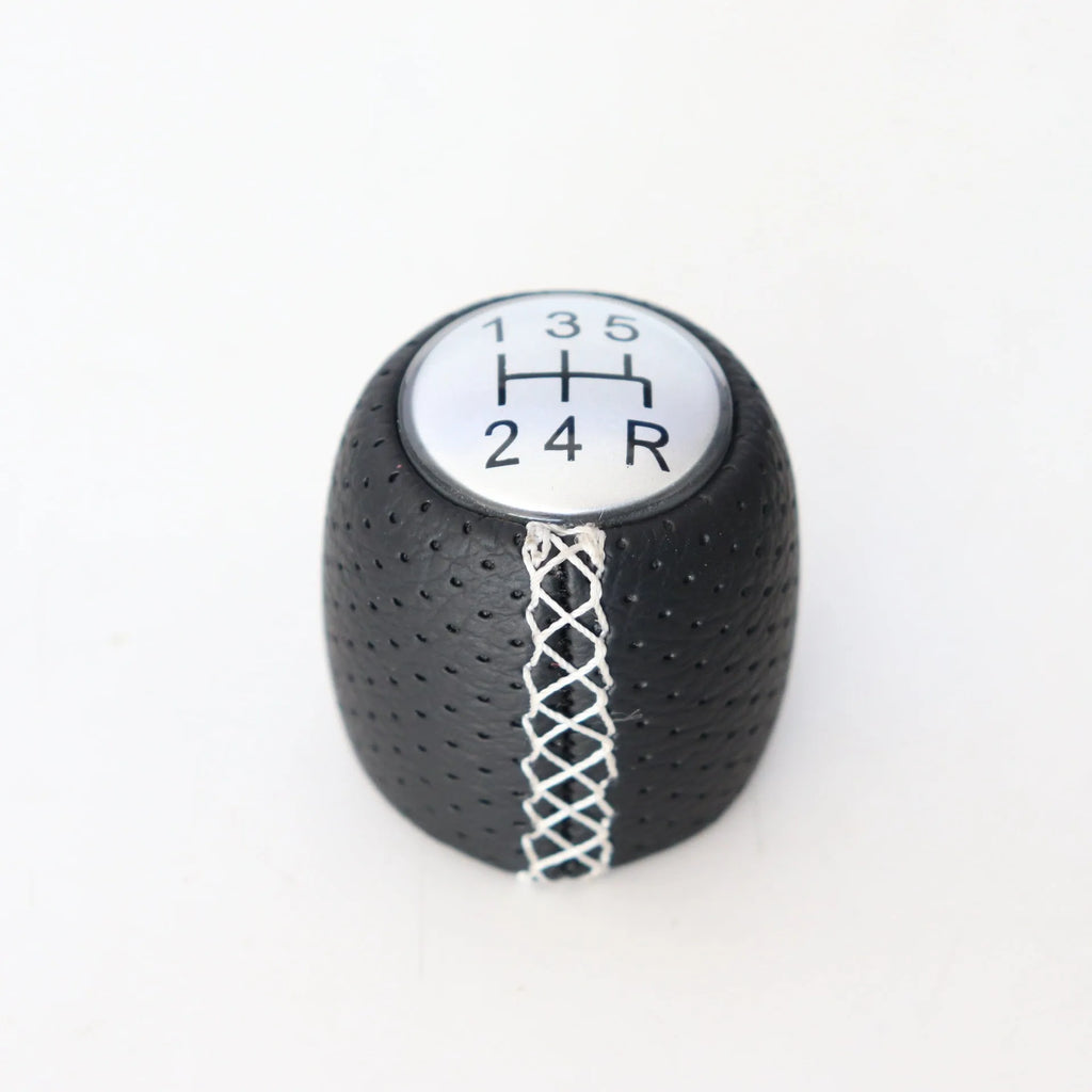 Sewn wrapped perforated leather gear lever handball for Alpha car in black, red, and white line options.