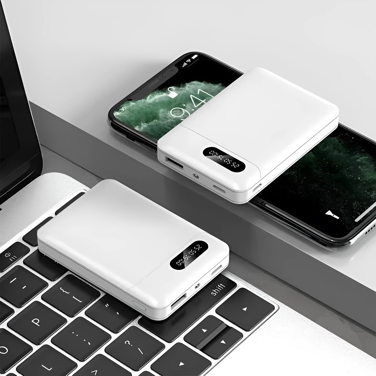 White and black portable power bank showing multiple USB ports and compact 92x63x23mm dimensions