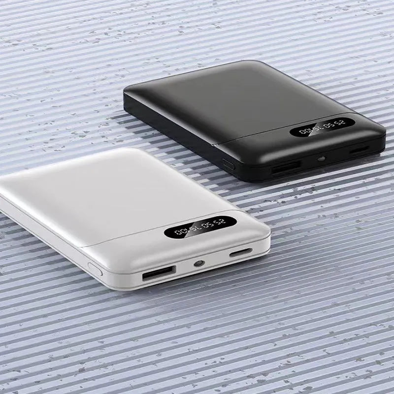 White and black portable power bank showing multiple USB ports and compact 92x63x23mm dimensions