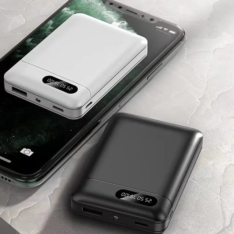 White and black portable power bank showing multiple USB ports and compact 92x63x23mm dimensions