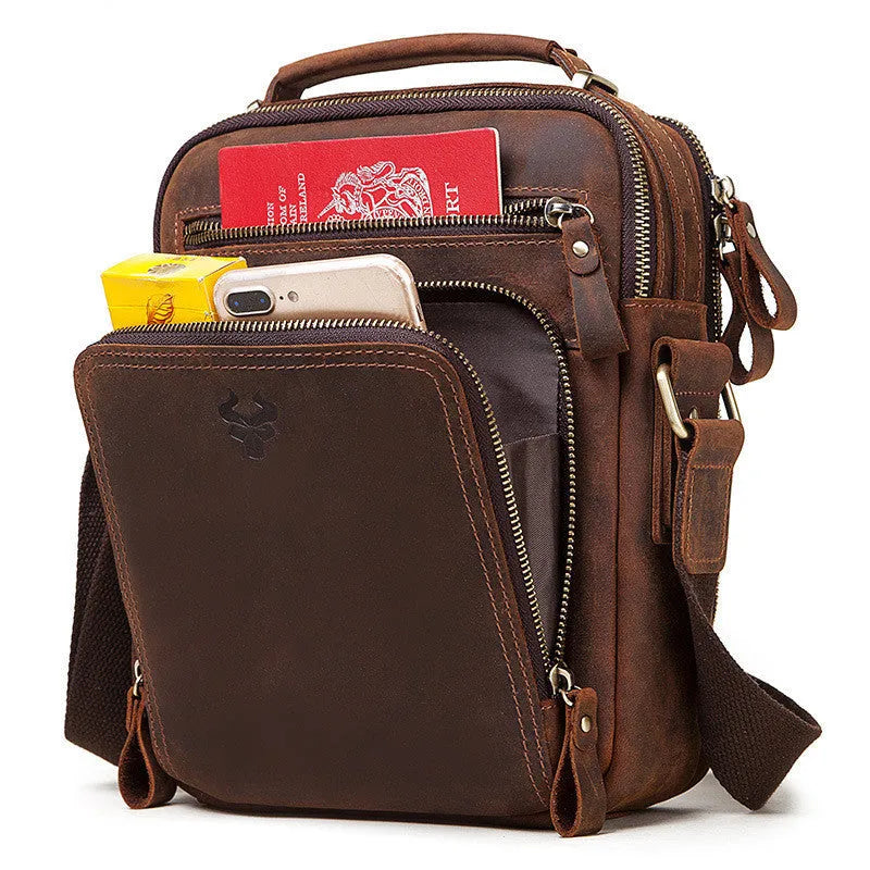 Men's brown Crazy Horse leather crossbody bag with single shoulder strap showing visible sewing lines