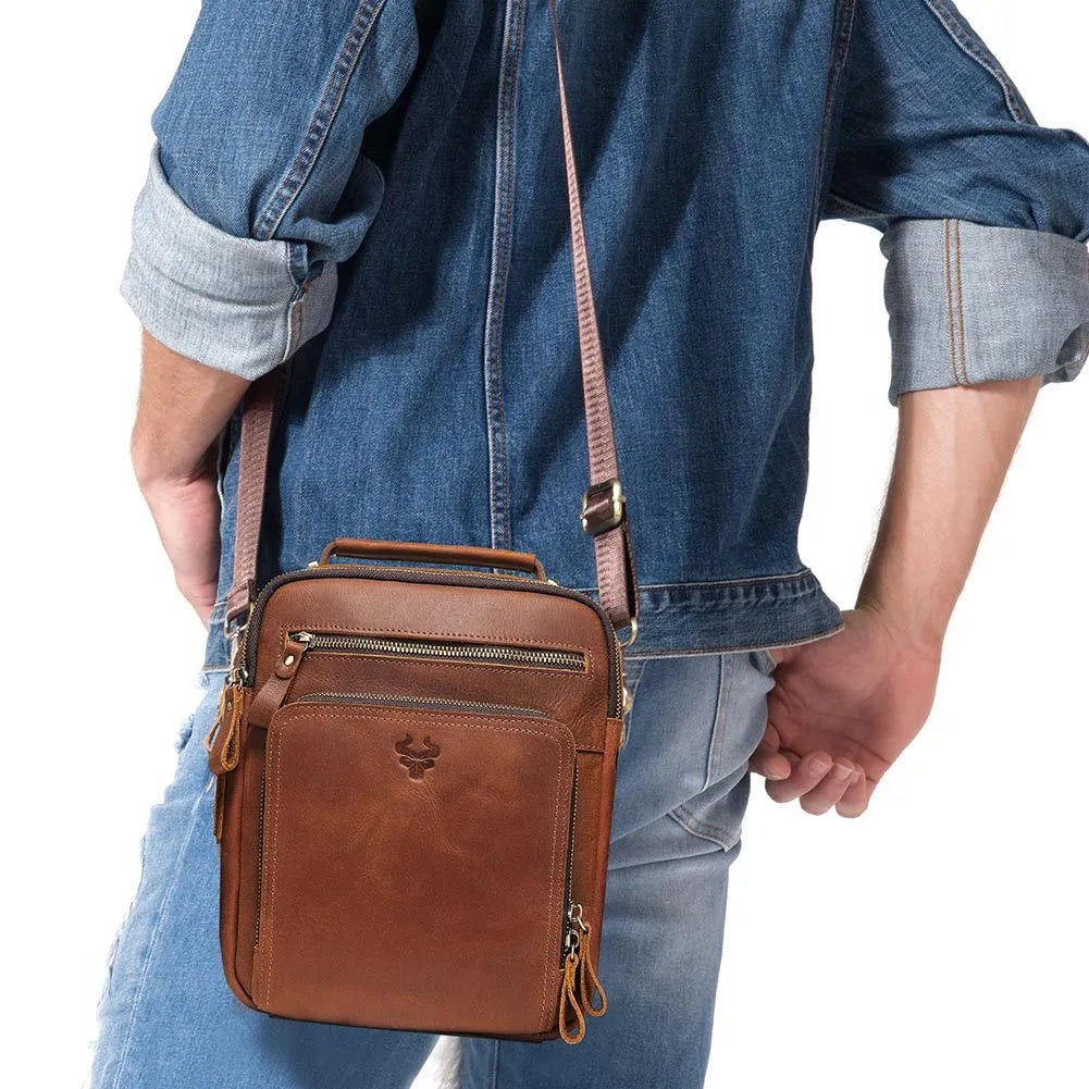 Men's brown Crazy Horse leather crossbody bag with single shoulder strap showing visible sewing lines