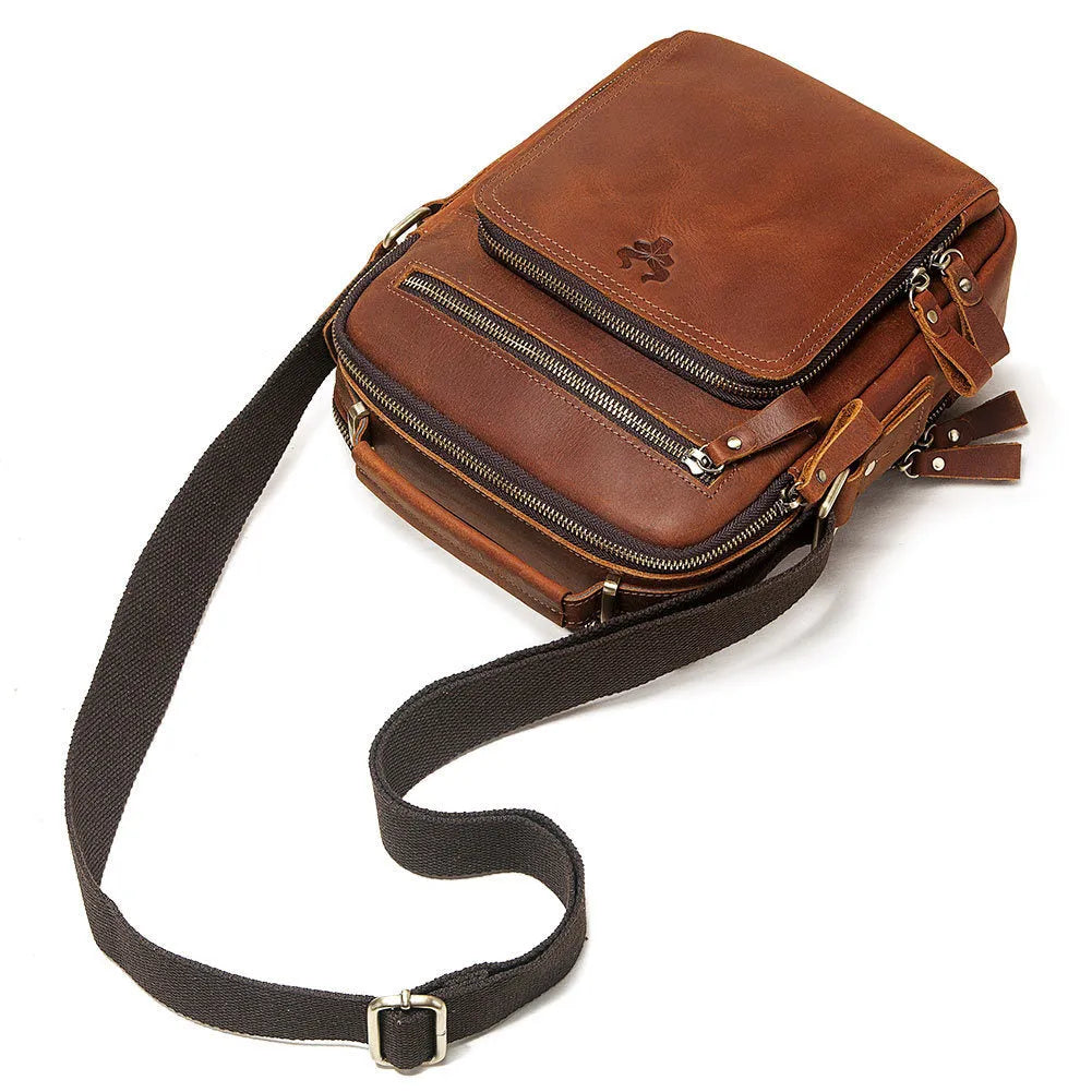 Men's brown Crazy Horse leather crossbody bag with single shoulder strap showing visible sewing lines