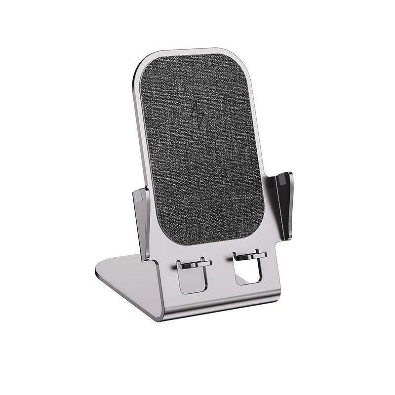 Metal desktop stand wireless charger in silver finish with phone charging on desk