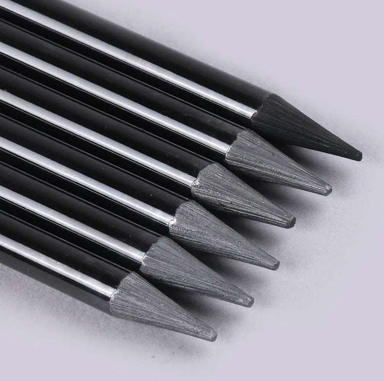 Set of six graphite pencils and three carbonized pencils packaged on a white suction card.