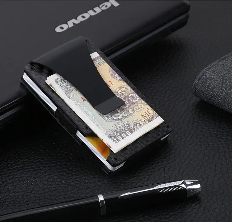 Black carbon fiber and aluminum RFID anti-magnetic card holder wallet on flat surface