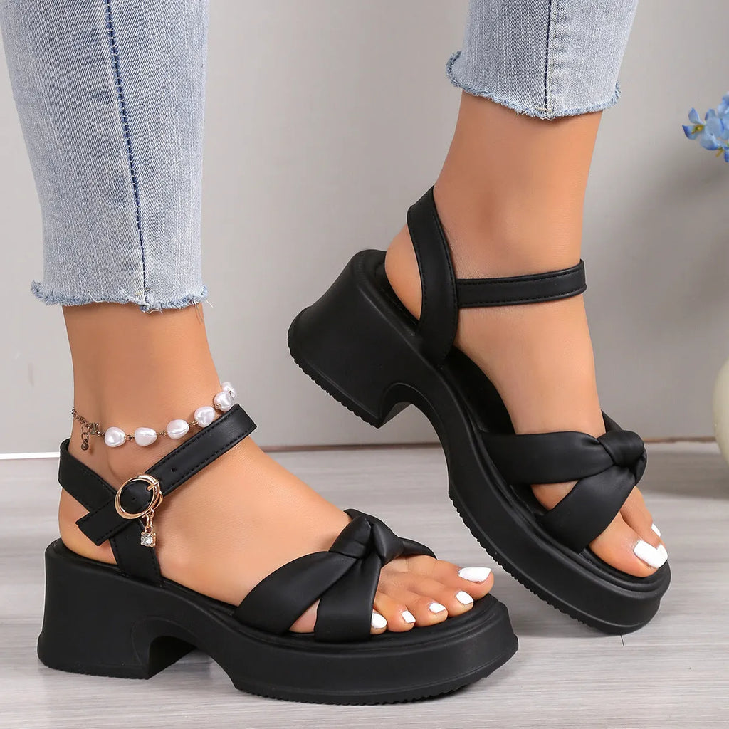 Women's black high heel slippers with thick platform sole and button closure