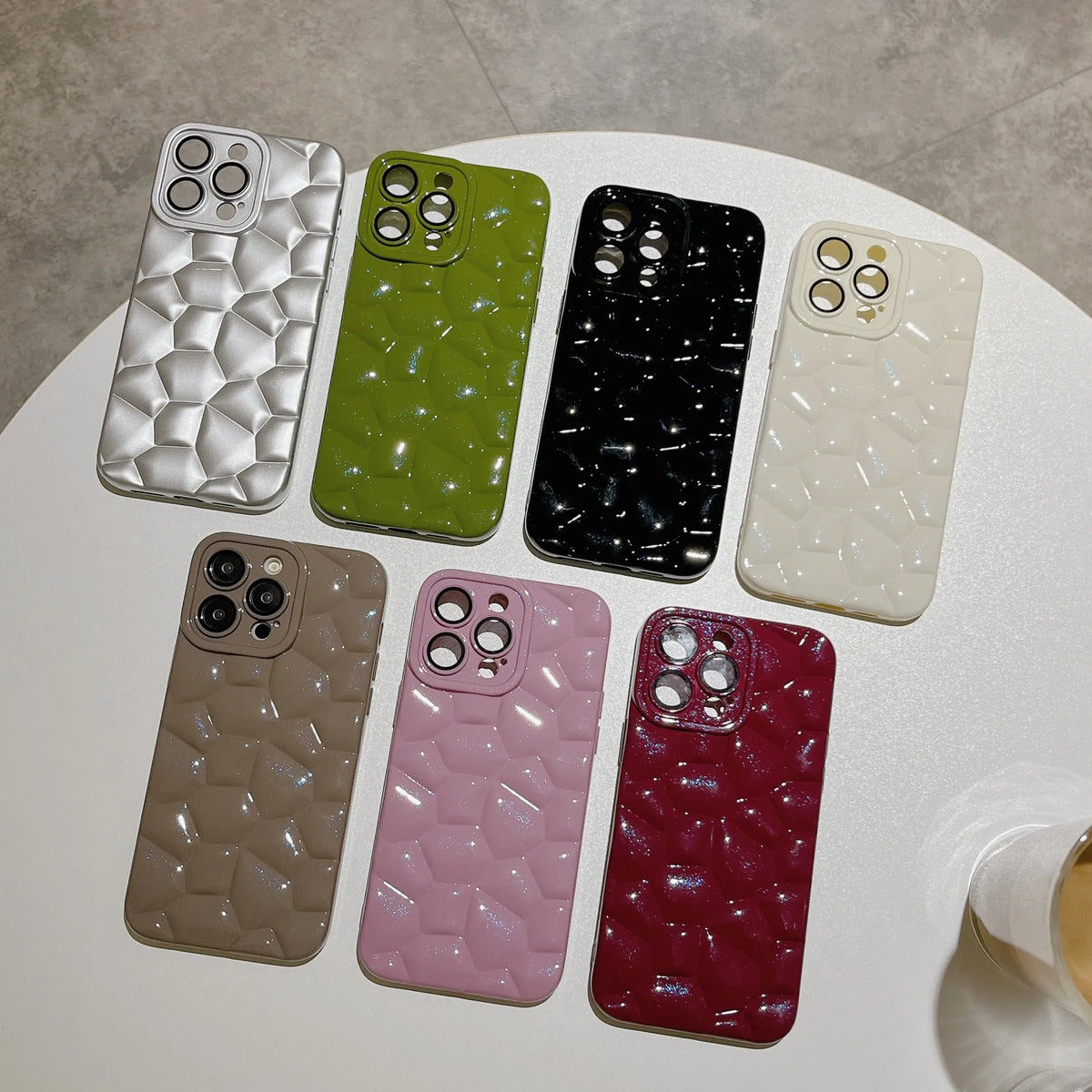 Pebble TPU mobile phone shell with lens protector for iPhone 11 to 15 Pro Max, shown in black, silver, white, brown, green, pink, and red