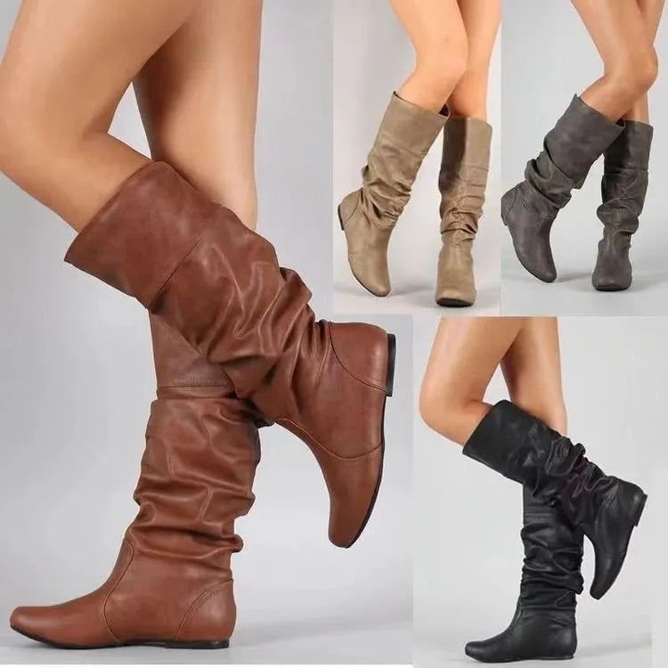 Women's flat-heel slip-on long boots in black with a round toe and high shaft.