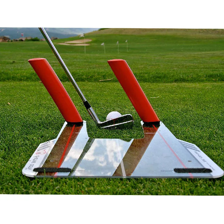 Red plastic putting practice mirror for golf alignment training on grass