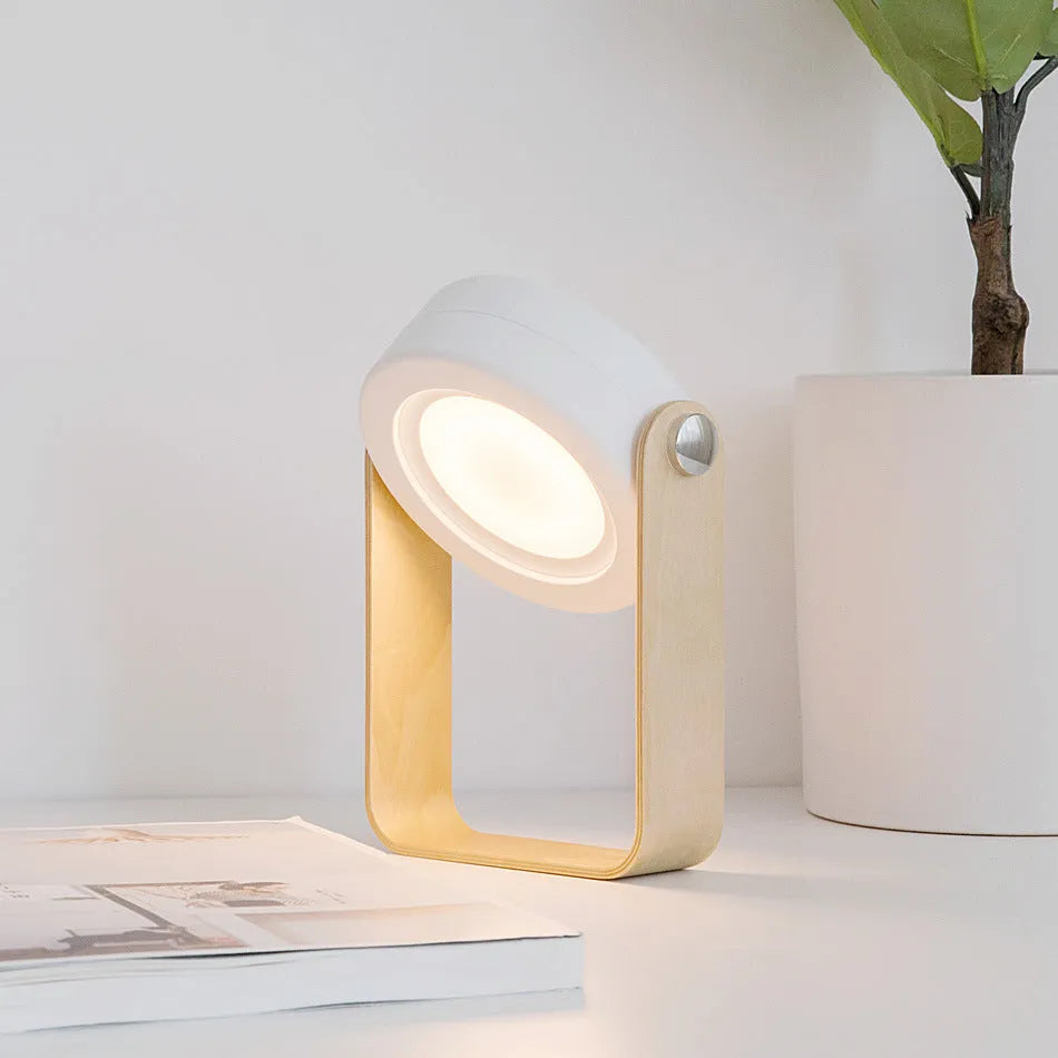Foldable touch dimmable LED night light in table lamp mode with wood and PC construction, white finish