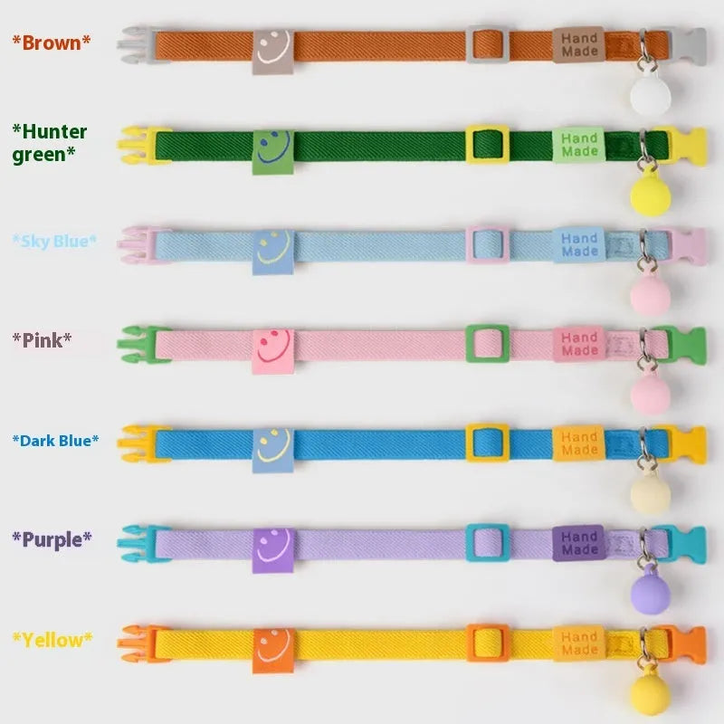 Small dog elastic collar in seven colour options showing yellow, pink, blue, purple, brown, navy and green versions
