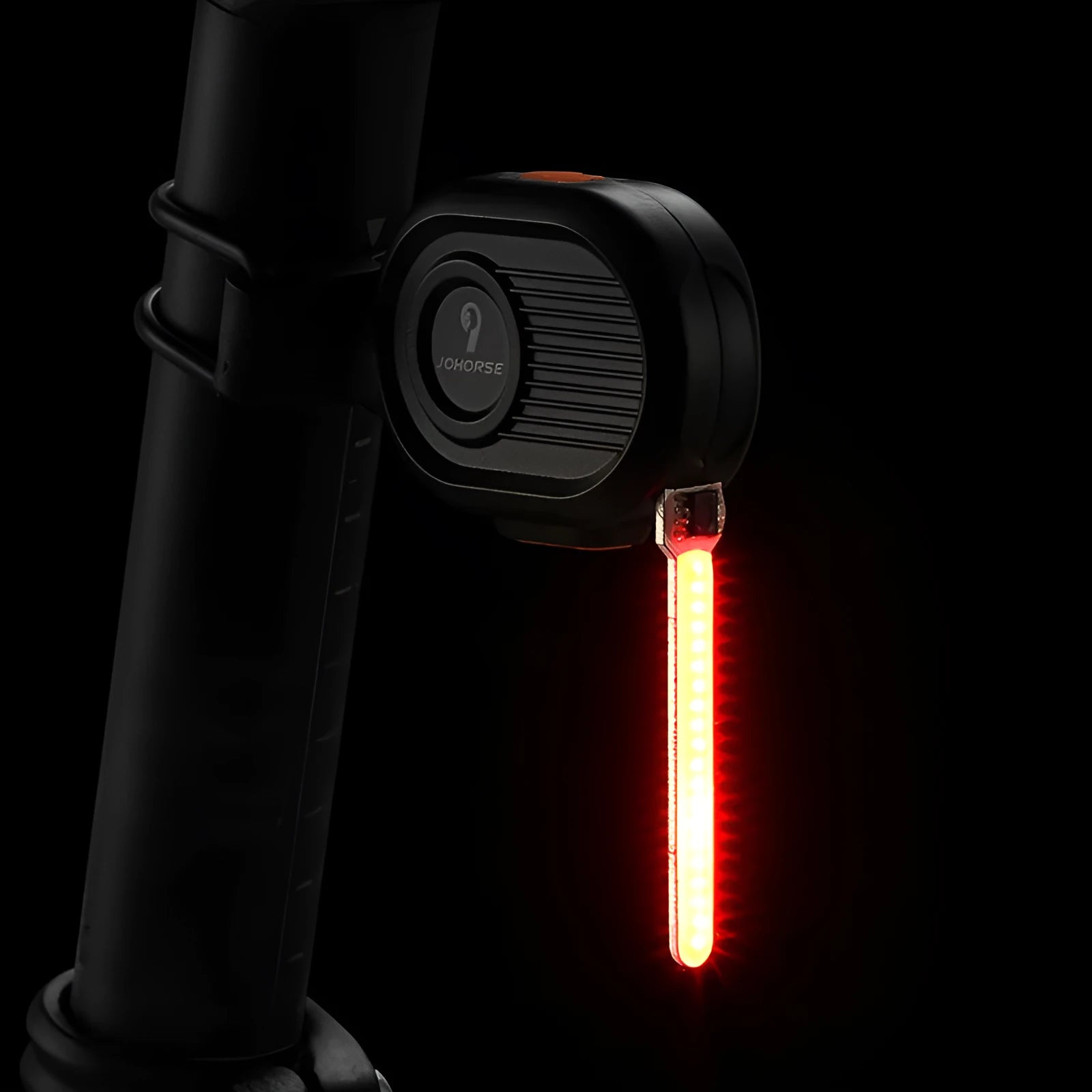 Bicycle tail light showing blue running waterfall light effect on a black background