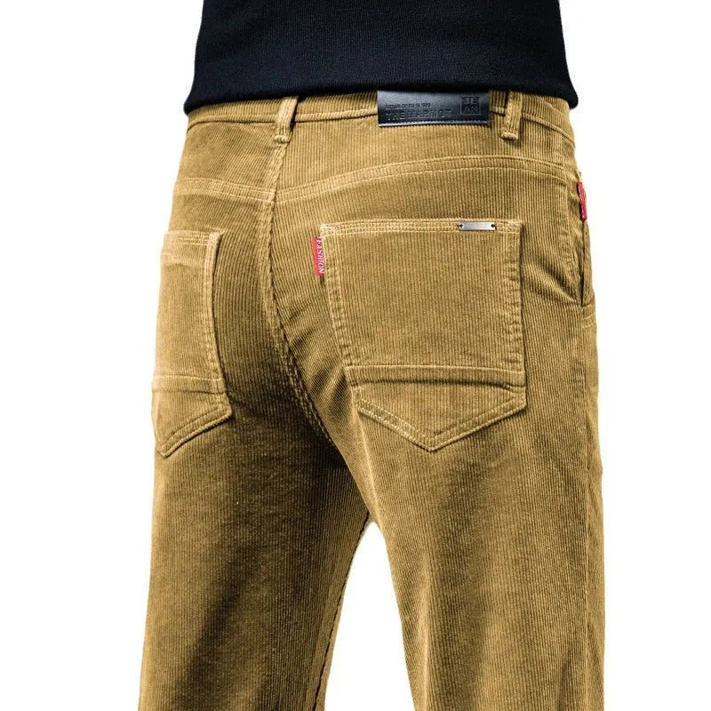 Straight slim-fit cotton corduroy trousers in black, side view, mid-waist, zip-placket fly