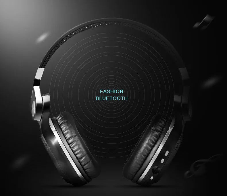 Black Bluetooth headset with an in-line card plug-in, shown as a head-mounted bilateral stereo unit.