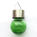 Solar cracked glass pendant light with rubber body and LED glow in garden setting