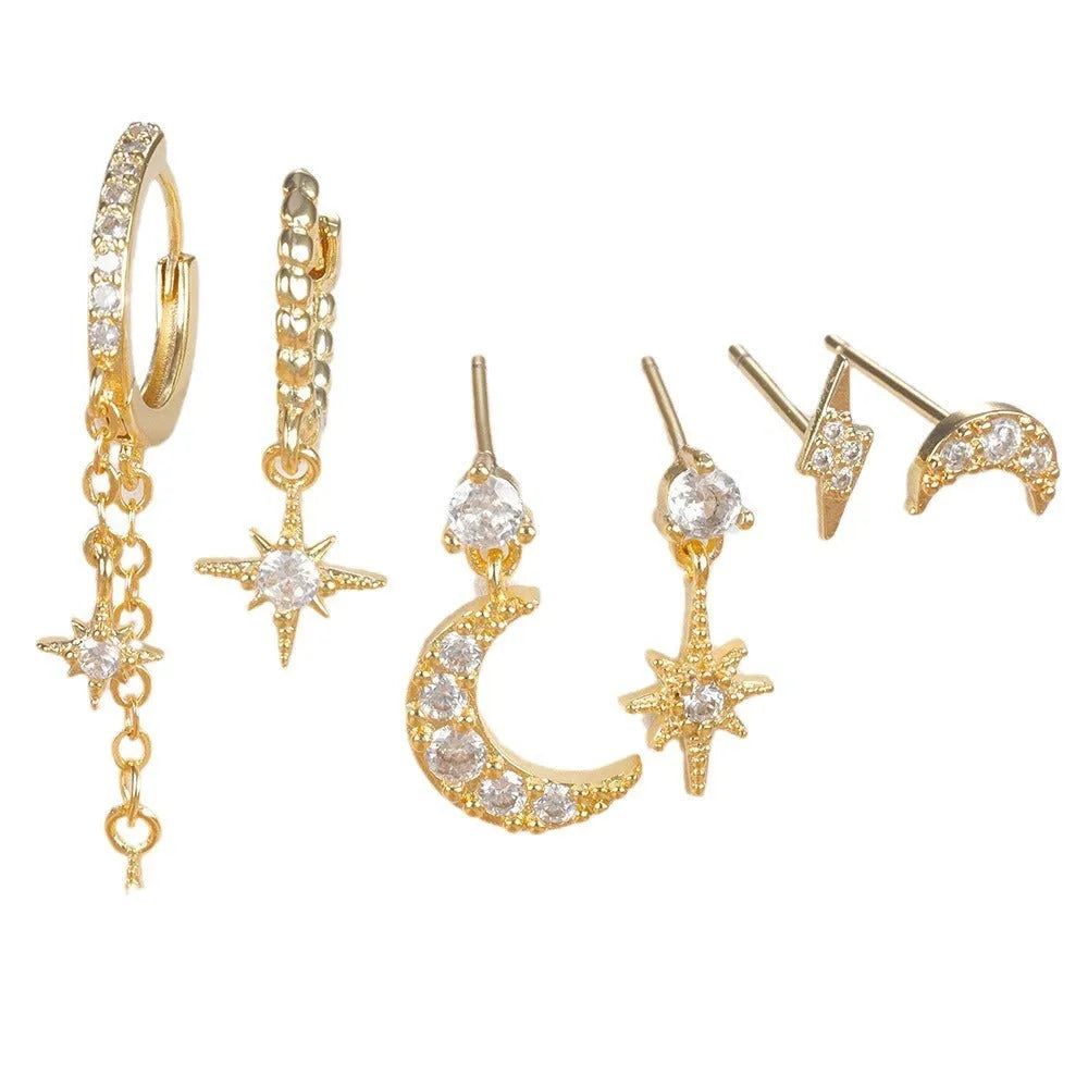 Set of six gold-colour chain tassel earrings with zircon studs, shown arranged together.