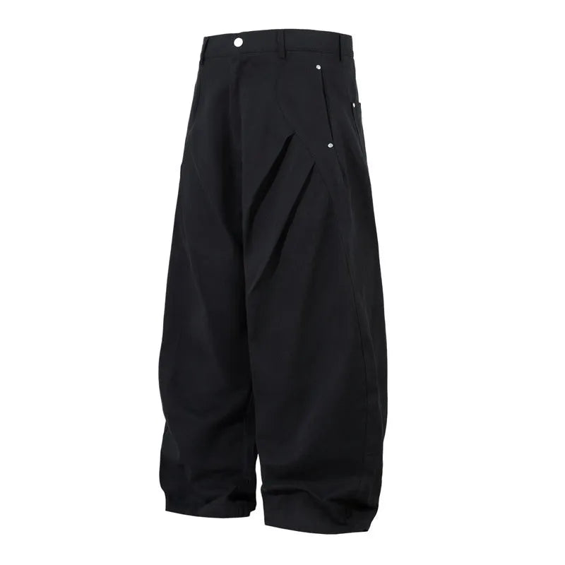 Men's black pleated casual trousers with wide-leg loose fit and machete pleat detailing