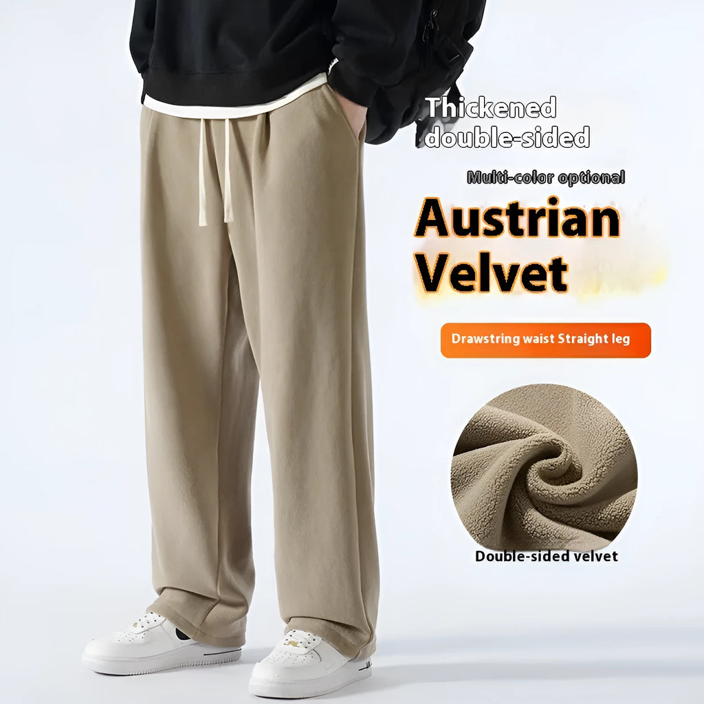 Men's apricot coloured loose-fit fleece-lined winter sports trousers with a drawstring waist laid flat.