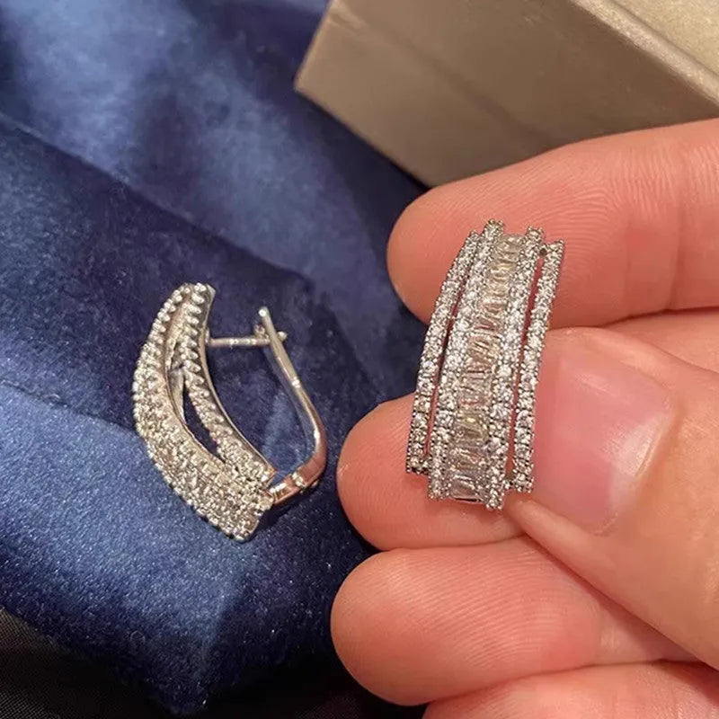 Geometric white gold colour zircon stud earrings with inlaid stone settings on copper