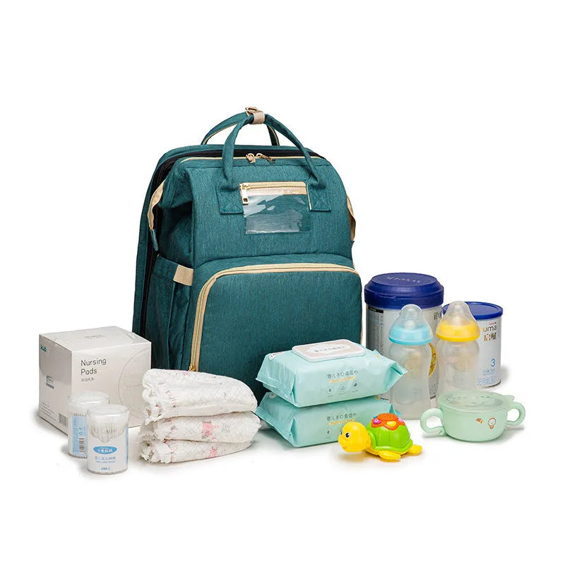 Folding baby bag bed backpack with portable mattress, USB charging option, front pocket, and multiple colour choices
