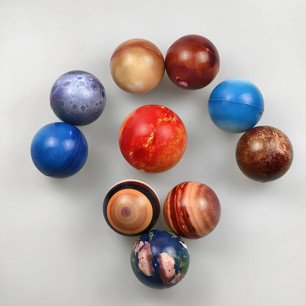 Set of eight solar system planet stress balls plus moon and sun in soft PU foam on white background