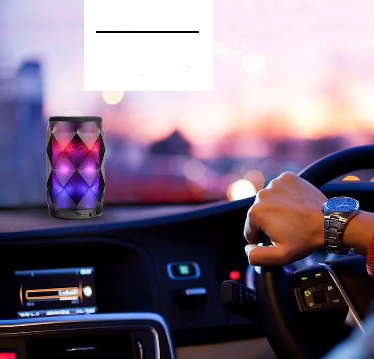 Black crystal diamond cut Coca-Cola can Bluetooth speaker lantern with colourful LED lights illuminated.