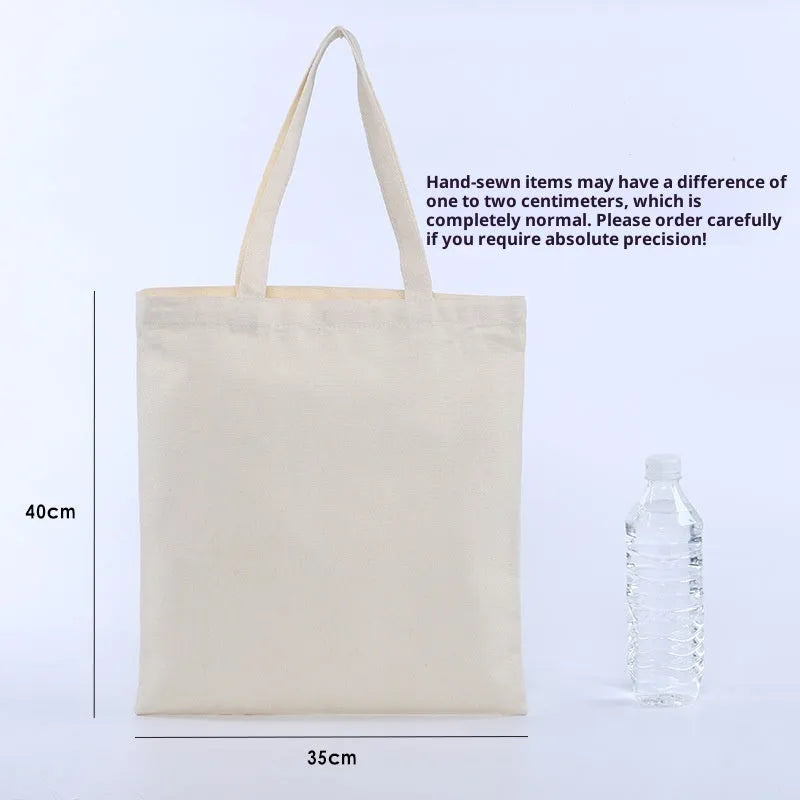Canvas single shoulder commuter bag in simple modern style, printed finish, available in black and white sizes 35x40cm and 20x25cm