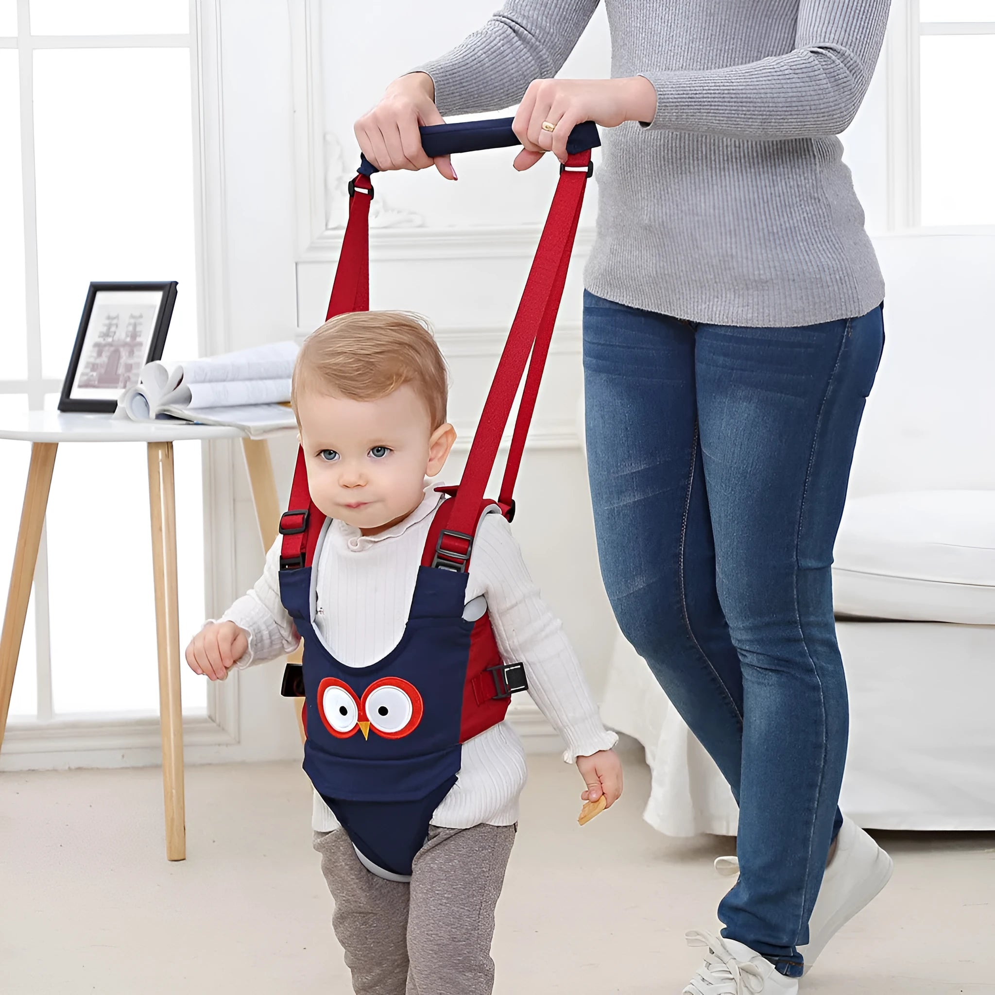 Baby walking harness belt in blue vest style showing adjustable straps for toddler walking support