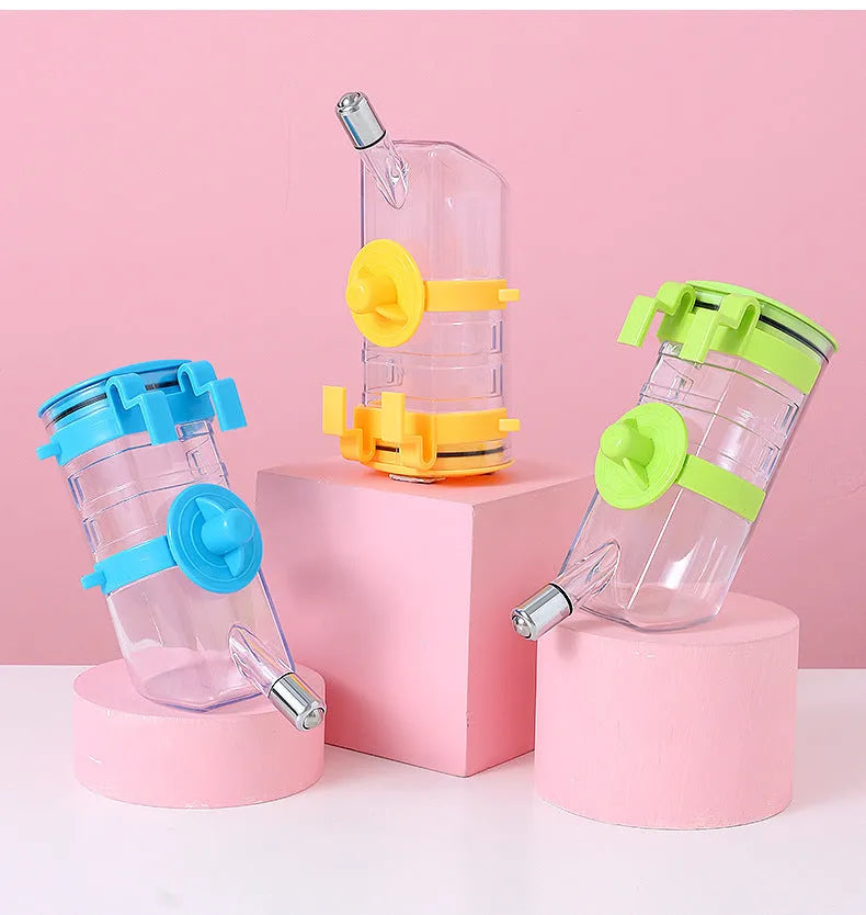 No drip dog kennel water bottle dispenser in blue, green, pink, or yellow, BPA-free plastic, for crates and cages