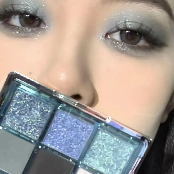 MUGELEEN nine-colour eye shadow palette showing low saturation blue and smoked shades