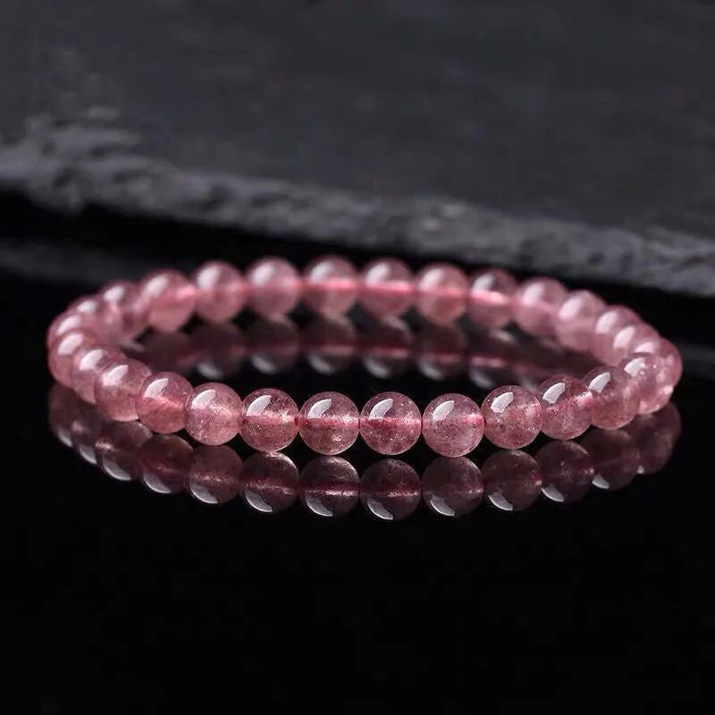 Women's strawberry quartz crystal bracelet with polished beads in three sizes