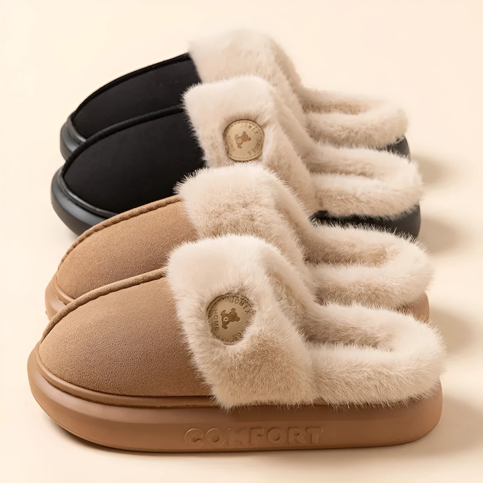 Pair of plush fleece slippers with textured PVC sole and cross stitching detail.