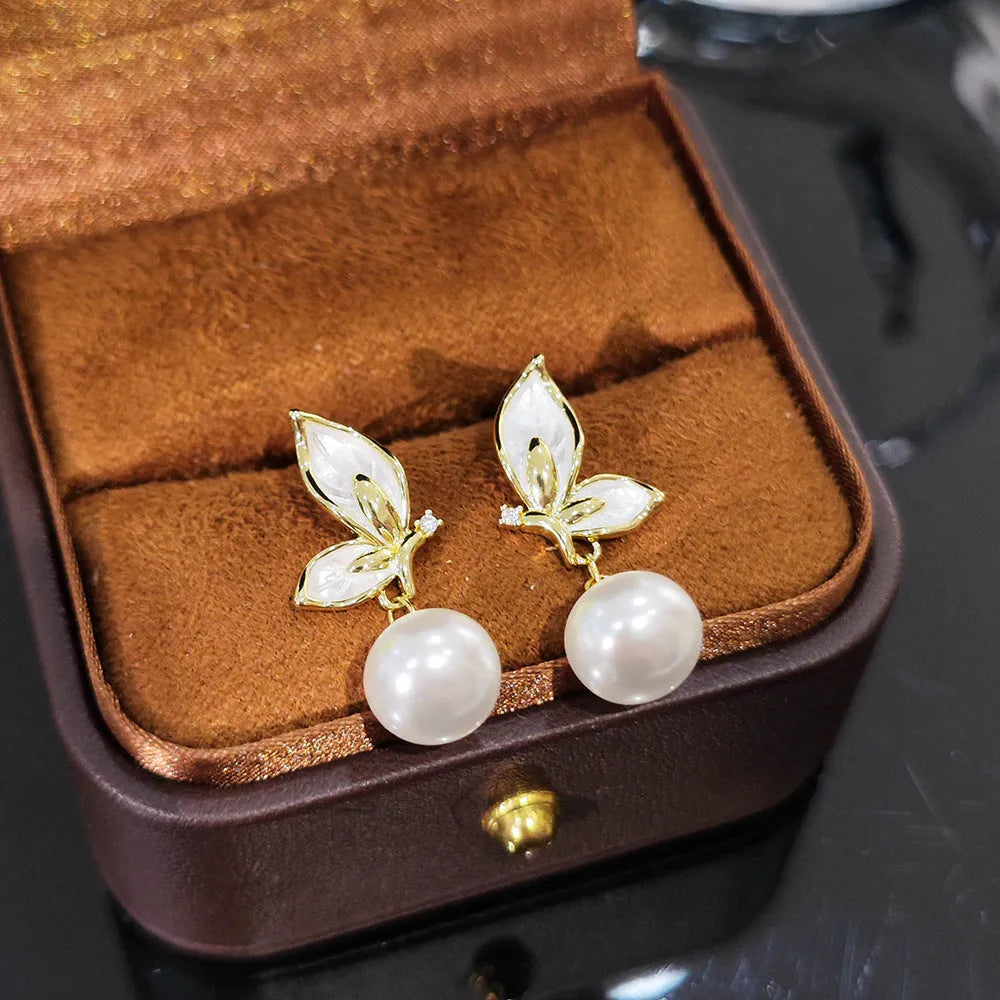 Zircon butterfly earrings for women in electroplated copper with simple geometric design