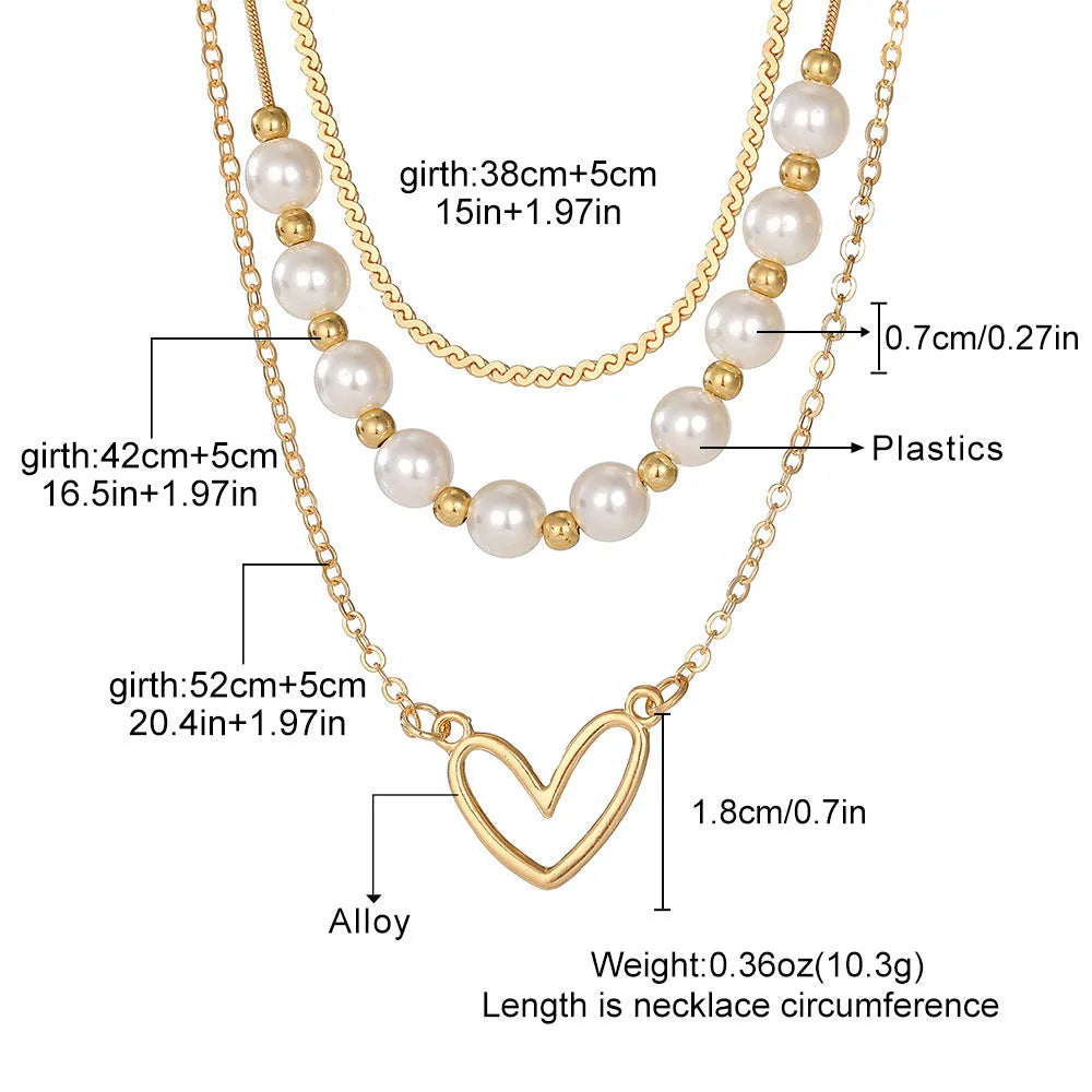 Gold electroplated vintage necklace with heart-shaped pendant on an adjustable pearl-style chain.