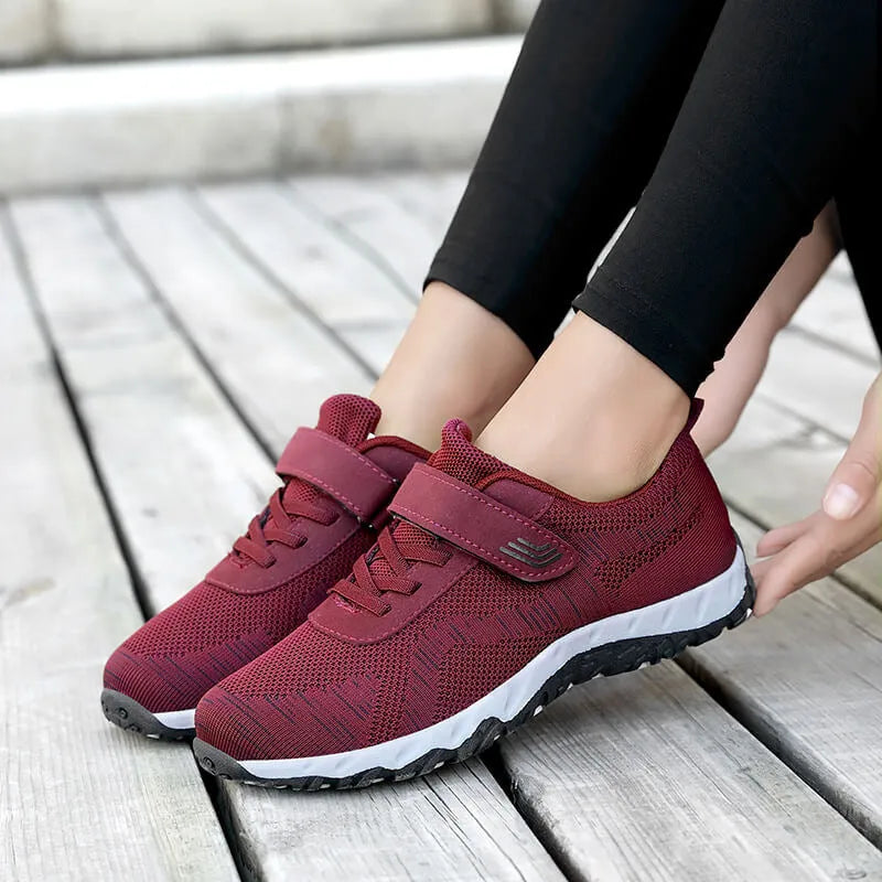 Women's low-top casual shoes with wedge heel, mesh upper, and Velcro closure in solid colours