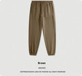 Men's solid colour velvet sweatpants with elasticated ankle banding in dark brown