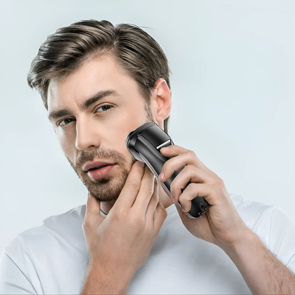 Men's electric shaver with three rotating heads, USB charging cable, and pop-up sideburn trimmer on display