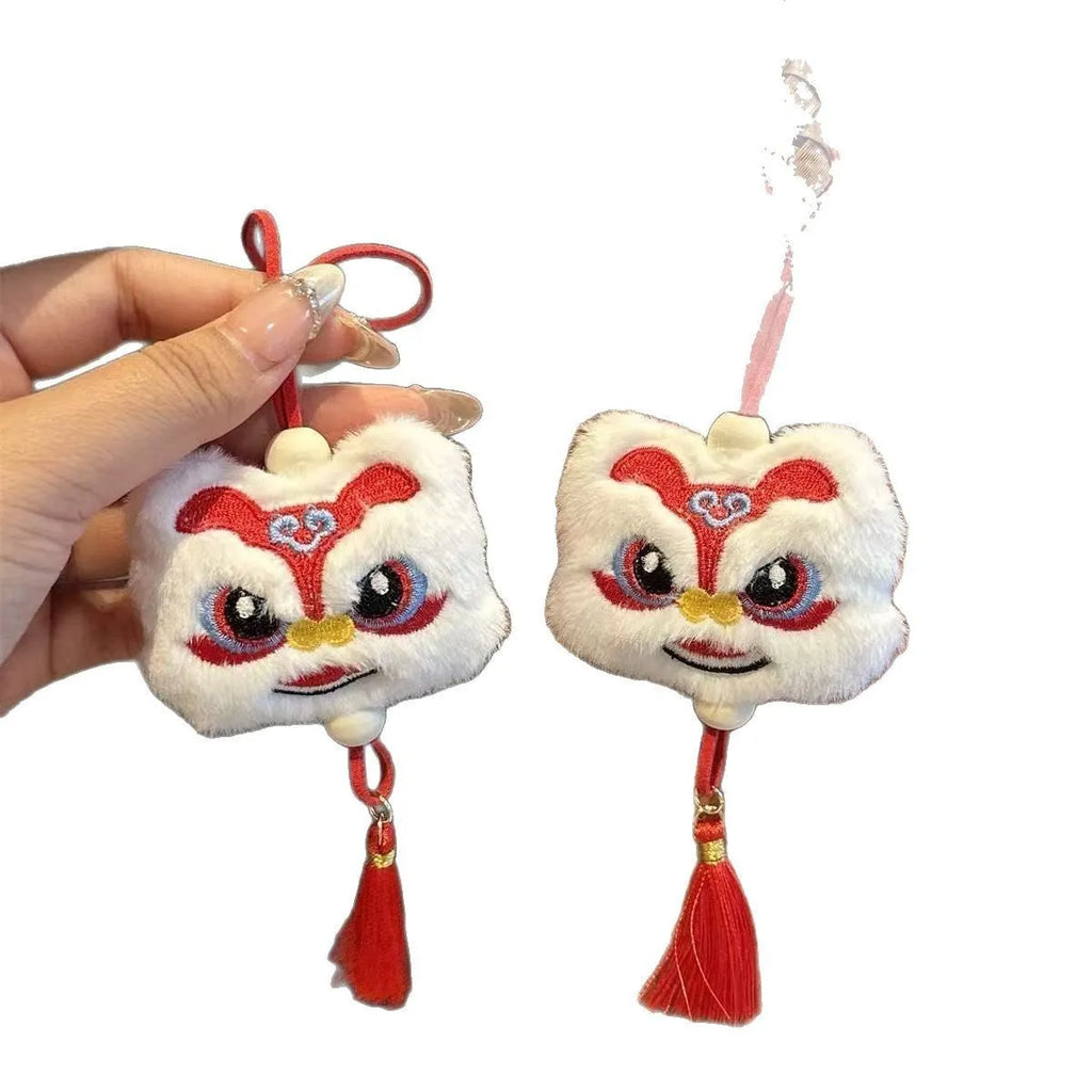 Chinese style blue and yellow plush lion keychain ornament with star stone decoration and cartoon styling